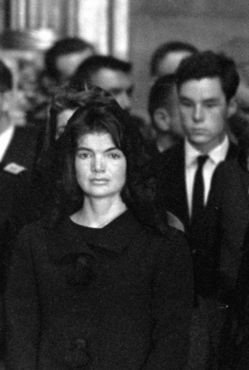 FILE - In this Sunday, Nov. 24, 1963 file photo, Jacqueline Kennedy looks toward the casket of her slain husband, President John F. Kennedy, during eulogies in the Capitol rotunda in Washington. (AP Photo)