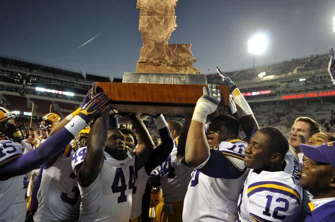 The LSU football team hoist "The Boot," a trophy given to the victor of the annual LSU-Arkansas game, following the Tiger's 20-13 win over the Razorbacks on Novmber 23, 2012 in Fayetteville.