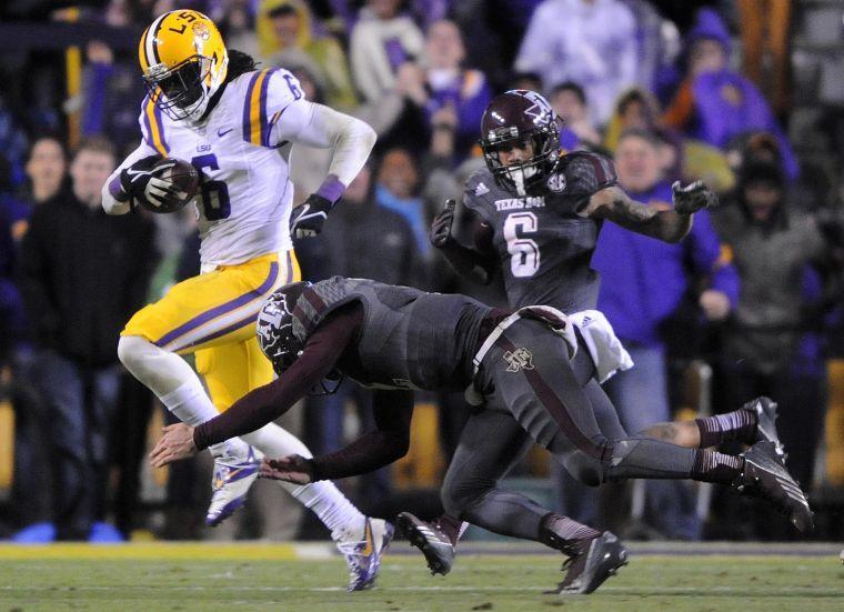 LSU senior safety Craig Loston (6) outruns Texas A&amp;M defenders Saturday Nov. 23, 2013 during the Tigers' 34-10 victory against Texas A&amp;M in Tiger Stadium.