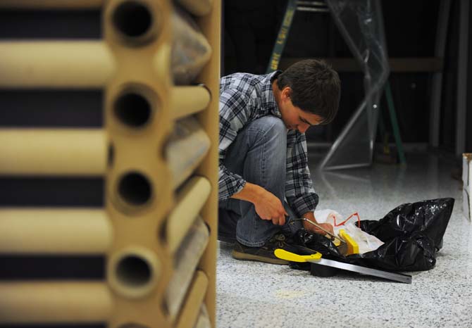 Architecture fourth year Nathaniel Frank prepares for thier installation project Tuesday, Nov. 12, 2013 at the LSU UREC.