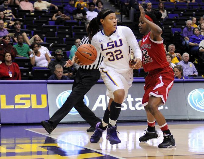 LSU sophomore guard Danielle Ballard (32) passes the ball Wednesday, Oct. 30, 2013 during the Lady Tiger's 95-24 victory agianst Tennessee Temple in the PMAC.