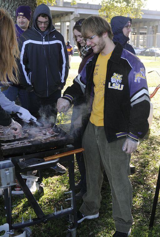 Mechanical Engineering senior and Kitchens on the Geaux cofounder Scott Burke cooks bacon for the homeless of Baton Rouge Sunday morning Nov. 24, 2013 at Expressway Park.