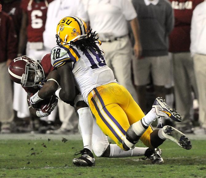 LSU senior linebacker Lamin Barrow (18) tackles Alabama sophomore running back Kenyan Drake (17) on Saturday, Nov. 9, 2013 during the Tiger's 38-17 loss to the Alabama Crimson Tide at Bryant-Denny Stadium in Tuscaloosa, AL.