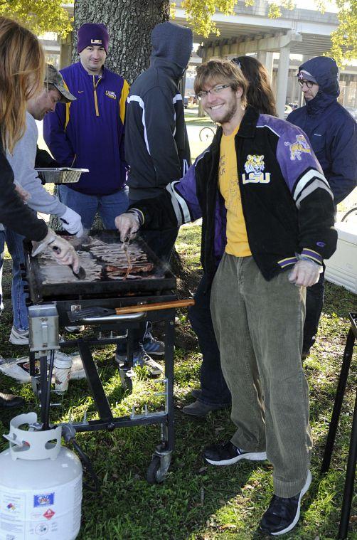 Mechanical Engineering senior and Kitchens on the Geaux cofounder Scott Burke cooks bacon for the homeless of Baton Rouge Sunday morning Nov. 24, 2013 at Expressway Park.