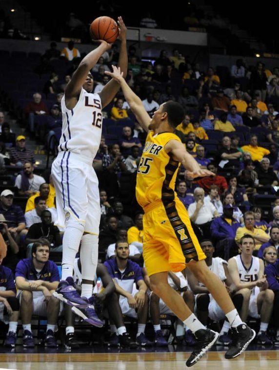 LSU freshman forward Jarell Martin (12) shoots the ball over Xavier sophomore forward Jarvis Thibodeaux (25) on Wednesday, Nov. 6, 2013, during the Tigers' 80-45 victory at the Pete Maravich Assembly Center