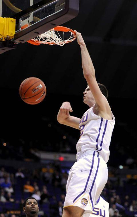 LSU freshman center Darcy Malone (22) shoots a slam dunk on Tuesday, Nov. 19, 2013 during the Tigers' 81-74 victory against University of New Orleans in the PMAC.