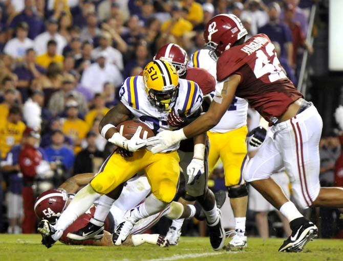 LSU sophomore running back Jeremy Hill (33) pushes forward Saturday Nov. 3, 2012 during the Tigers' 21-17 loss to Alabama in Tiger Stadium.