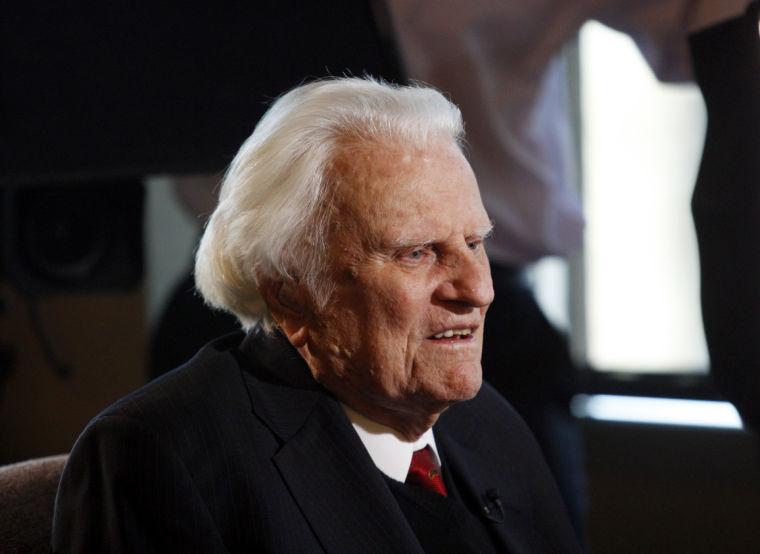 FILE- In this Dec. 20, 2010 file photo, evangelist Billy Graham is interviewed at the Billy Graham Evangelistic Association headquarters in Charlotte, N.C. The evangelist turns 95 on Thursday Nov. 7, 2013 and a big party is planned to celebrate the occasion. Graham's son Franklin has said that as many as 700 people have been invited to the party in Asheville, N.C. (AP Photo/Nell Redmond, File)