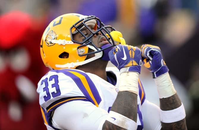 LSU sophomore running back Jeremy Hill (33) celebrates in the endzone Friday, Nov. 29, 2013 during the Tigers' 31-27 victory against Arkansas in Tiger Stadium.