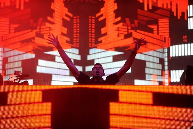 Nick van de Wall, known by his stage name Afrojack, pumps up the crowd during his set on the Le Plur Stage on Saturday Nov. 2, 2013 at the 2013 Voodoo Music + Arts Experience.