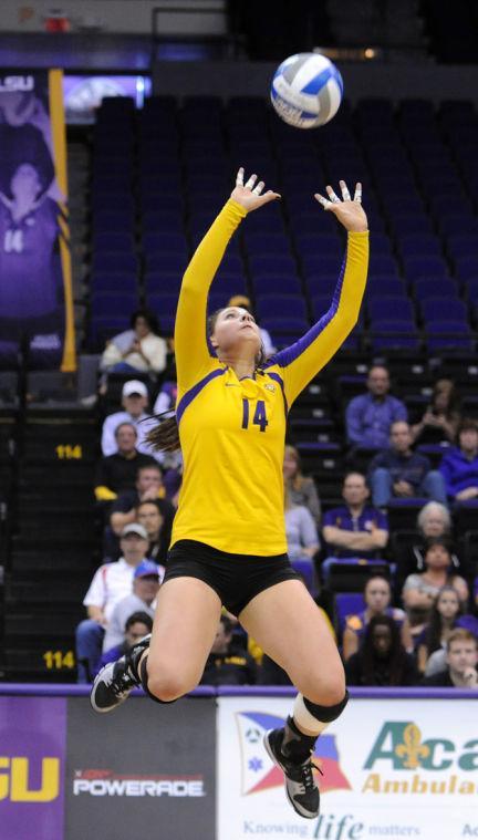 LSU junior setter Malorie Pardo (14) sets a spike Friday, Nov. 1, 2013 during the Tiger's 3-1 loss to the Florida Gators in the PMAC.