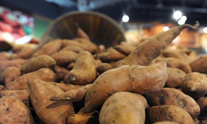 Yams are on display Monday, Nov. 25, 2013, at the Highland Neighborhood WalMart