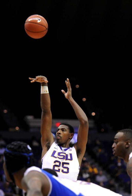 LSU freshman forward Jordan Mickey (25) tries to shoot a goal on Tuesday, Nov. 19, 2013 during the Tigers' 81-54 victory against University of New Orleans in the PMAC.