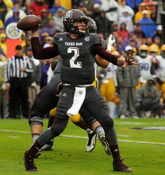 Texas A&amp;M sophomore quarterback Johnny Manziel (2) attempts a pass Saturday, Nov. 20, 2013 during the Tiger's 34-10 victory against the Aggies.