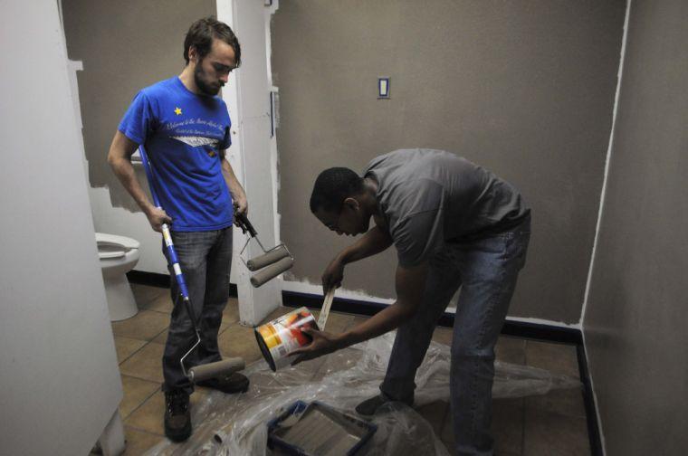 Fourth year Architecture studen Andrew Layman and second year architecture student Charlston Britton repaint the lavatories with other members of Freedom of Design on Saturday, Nov. 16, 2013 as a service to Raven's Outreach Center for Homeless Veterans located at 1913 North Street in Baton Rouge.