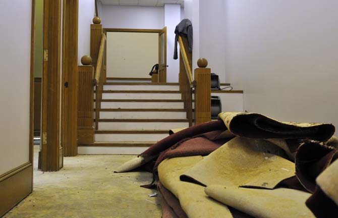 Some ripped up carpet sits in front of a staircase leading to much more of the restaurant school that's in construction on Tuesday, November 5, 2013 in the building that will soon be Triumph Kitchen on 3rd Street downtown.