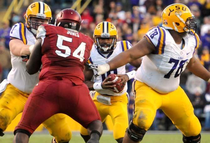 LSU freshman quarterback Anthony Jennings (10) looks downfield Friday, Nov. 29, 2013 during the Tigers' 31-27 victory against Arkansas in Tiger Stadium.