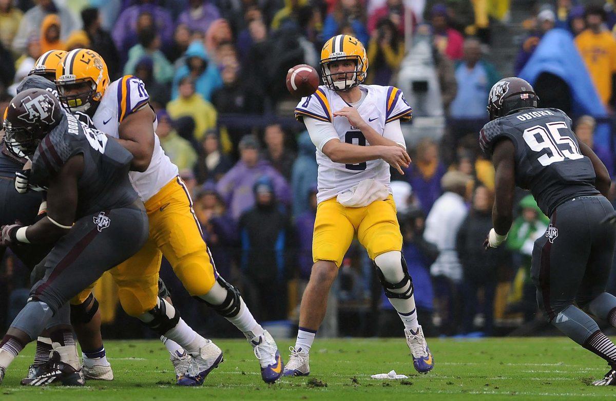 LSU senior quarter back Zach Mettenberger (8) throws a pass Saturday Nov. 23, 2013 during the Tigers' 34-10 victory against Texas A&amp;M in Tiger Stadium.