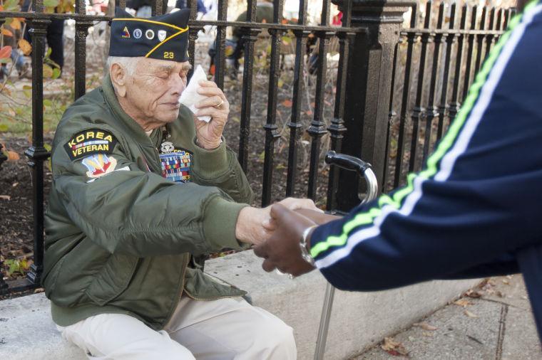 Larry Nanney, of Rockfield, Ky., a Korean War Veteran who served with the Army and Air Force is overcome with emotion while greeting people during the Bowling Green-Warren County Veterans Day Parade, Saturday, Nov. 9, 2013, in Bowling Green, Ky. (AP Photo/Daily News, Alex Slitz)