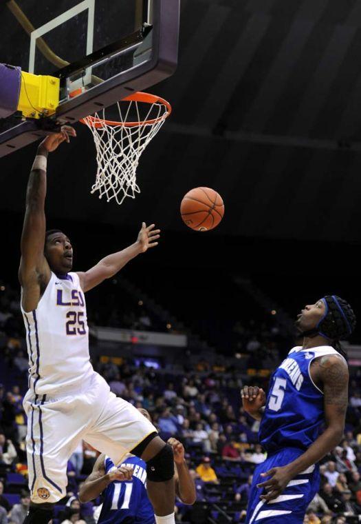 LSU freshman forward Jordan Mickey (25) leaps toward the basket Tuesday, Nov. 19, 2013 during the Tigers' 81-54 victory against UNO in the PMAC.