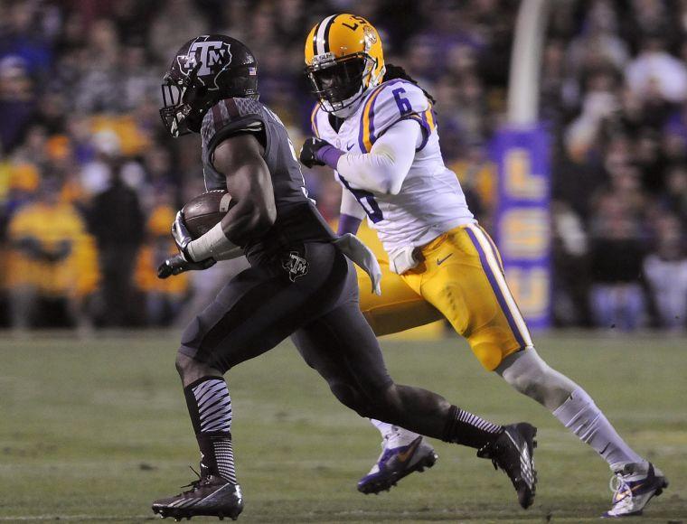 LSU senior safety Craig Loston (6) chases Texas A&amp;M sophomore Trey Williams (3) Saturday Nov. 23, 2013 during the Tigers' 34-10 victory against Texas A&amp;M in Tiger Stadium.