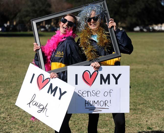 Kinesiology freshman Claire Keaton (left) and communication disorders freshman Mary Kate McHugh (right) pose with self-affirmations Wednesday, November 13, 2013 at the Southern Smash event on the Parade Grounds.