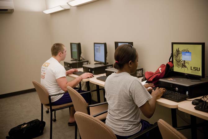 Biological Sciences freshman Scott Swiler, left, and Biological Engineering junior, right, work in the computer lab of Evangeline Hall.