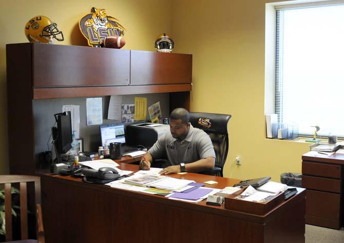 Former LSU running back Jusin Vincent works in his office Monday, Nov. 19, 2013 in the Football Operations Building.