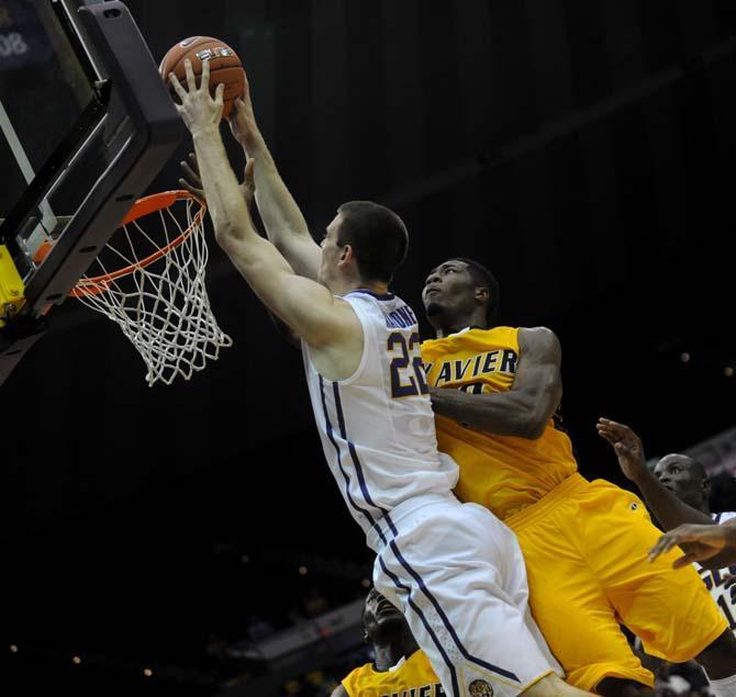 LSU freshman center Darcy Malone (22) launches the ball towards the hoop Wednesday, Nov. 6, 2013, during the Tigers' 80-45 victory at the Pete Maravich Assembly Center.