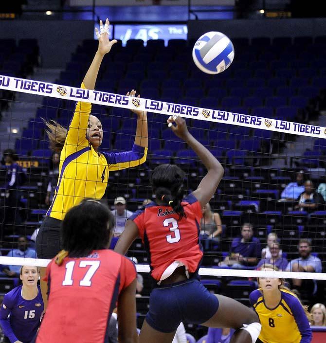 LSU senior middle blocker Desiree Elliott (4) prepares to spike the ball Friday, October 11, 2013 during the Tigers' victory against Ole Miss in the PMAC.