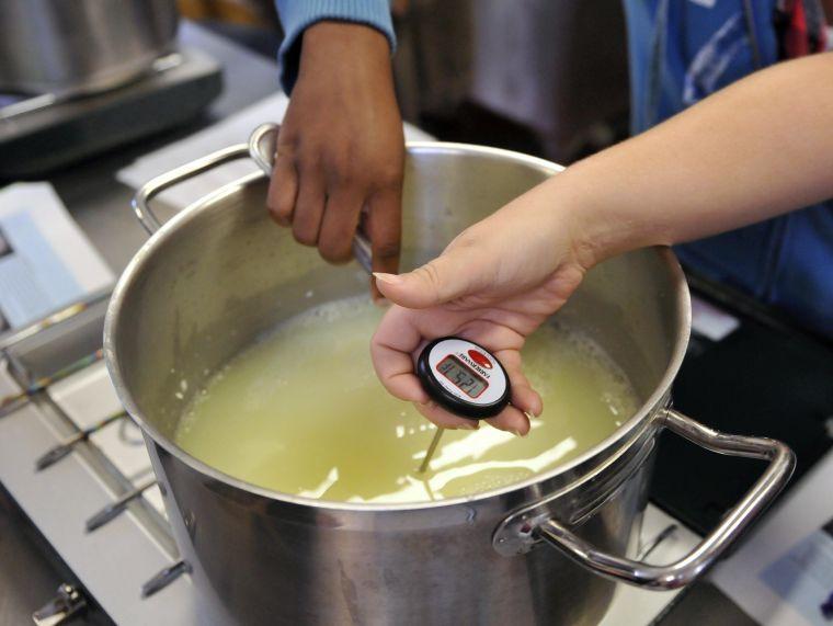 Students prepare cottage cheese for their Dairy Products class Thursday, Oct. 31, 2013 in the Dairy Sciences Building.