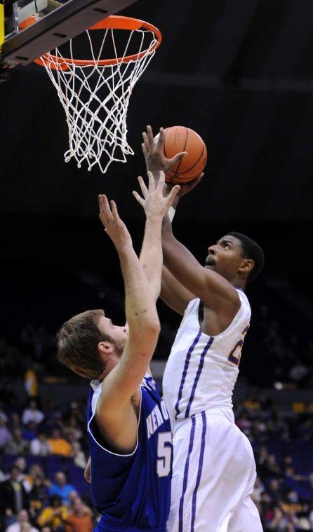 LSU freshman forward Jordan Mickey (25) makes an attempt to shoot a goal on Tuesday, Nov. 19, 2013 during the Tigers' 81-54 victory against University of New Orleans in the PMAC.