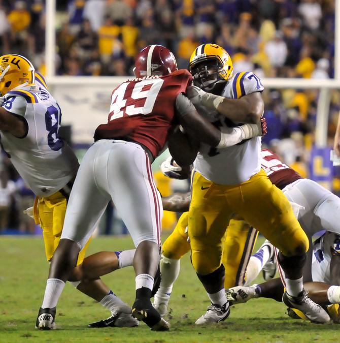 LSU freshman offensive tackle Vadal Alexander (78) blocks Alabama junior defensive tackle Ed Stinson (49) during the Tiger's 21-17 loss to the Crimson Tide at Tiger Stadium