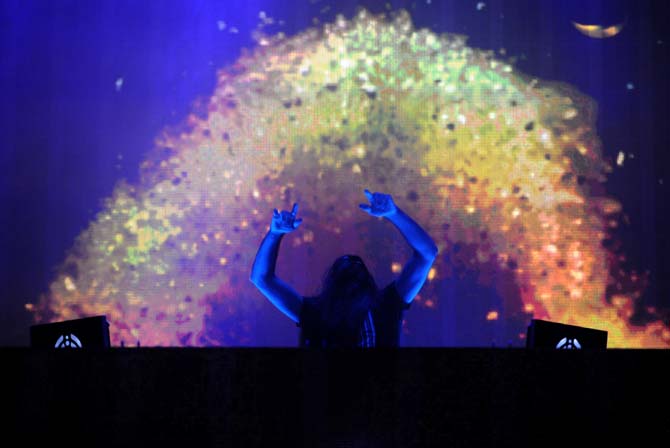 Lorin Ashton, known by his stage name Bassnectar, dances during his set on the Le Plur Stage on Sunday Nov. 3, 2013 at the 2013 Voodoo Music + Arts Experience.
