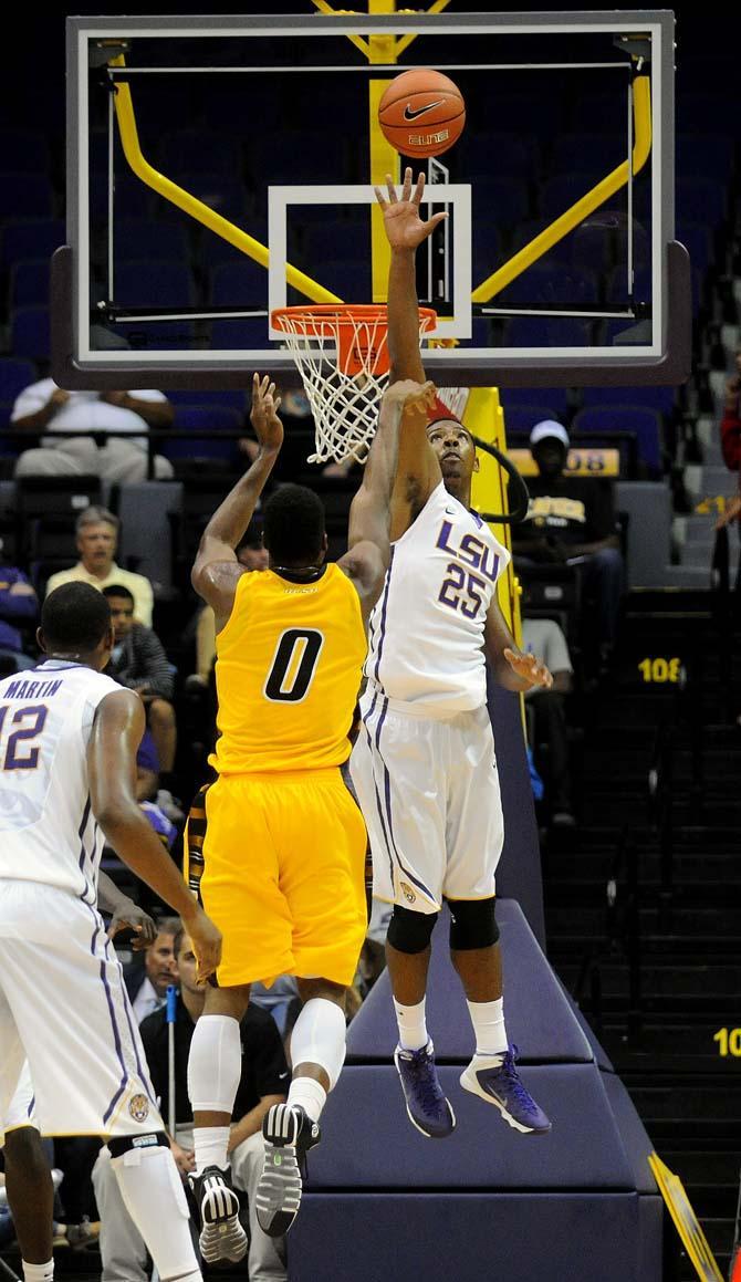 LSU freshman forward Jordan Mickey (25) blocks the shot by Xavier junior forward Sydney Coleman (0) Wednesday, Nov. 6, 2013, during the Tigers' 80-45 victory at the Pete Maravich Assembly Center