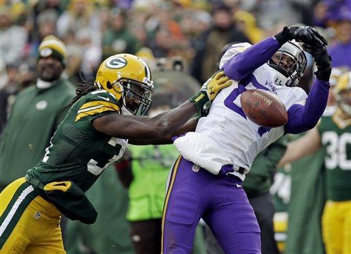 Green Bay Packers' Davon Housebreaks up a pass intended for Minnesota Vikings' Cordarrelle Patterson during the second half of an NFL football game Sunday, Nov. 24, 2013, in Green Bay, Wis. The game ended in a tie, 26-26. (AP Photo/Mike Roemer)