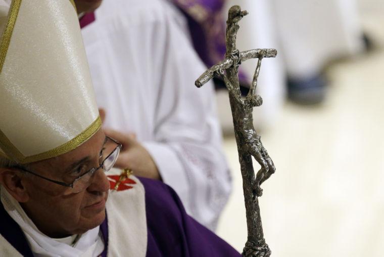 Pope Francis leaves at the end of a Mass on the occasion of his visit at the Parish Church of St. Cirillo Alessandrino, in Rome, Sunday, Dec. 1, 2013. (AP Photo/Gregorio Borgia)