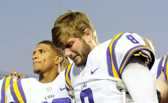 LSU senior quarterback Zach Mettenberger (8) is overcome with emotion Friday, Nov. 29, 2013 after the Tigers' 31-27 victory against Arkansas in Tiger Stadium.