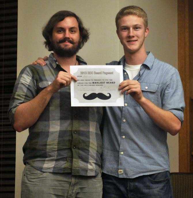 Political science senior Chris Vasser accepts his award Tuesday, December 3, 2013, at the South Hall Residential College.