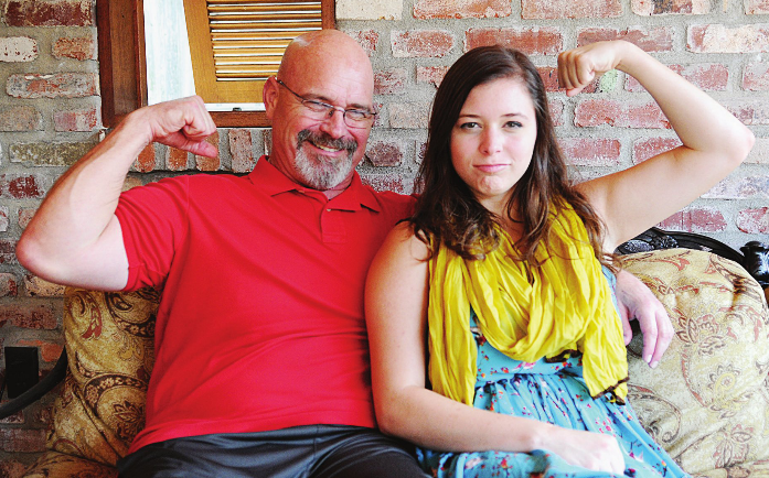 Kaci Yoder (right) sits with her dad (left) at their home in Baton Rouge. Kaci urges students to listen and support their friends and peers during difficult times.