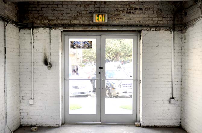 Sunlight floods through a glass doorway Tuesday afternoon inside the Studio Arts Buildings on campus.