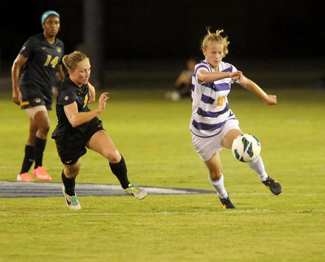 LSU freshman defender Megan Lee (13) drives down the field Friday, Oct. 11, 2013 during the 1-0 victory against Mizzou at LSU Soccer Stadium.