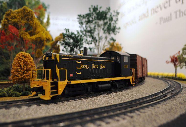 A model train travels around a track created by the Greater Baton Rouge Model Railroaders in the "Getting There" exhibition at the LSU Museum of Art at The Shaw Center for the Arts in downtown Baton Rouge.