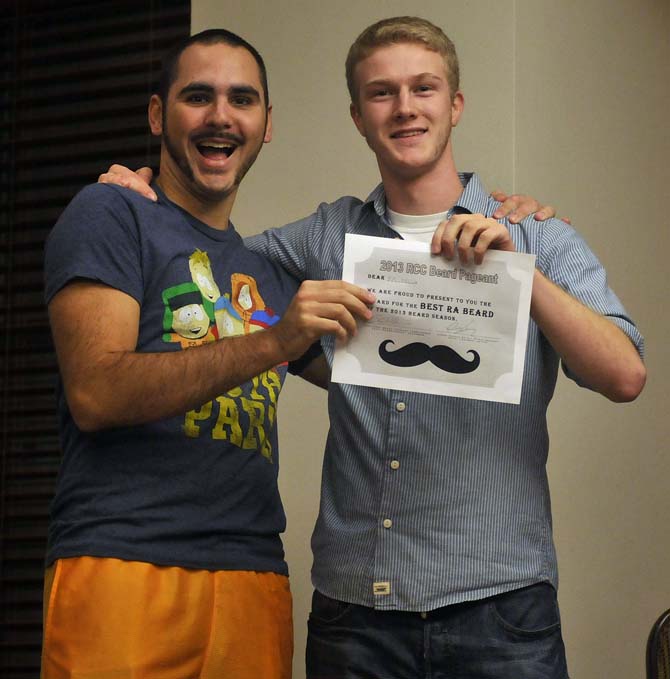 Mass Communications major Adrian Wintz celebrates winning the "Best RA Beard" Tuesday, December 3, 2013, at the South Hall Residential College.