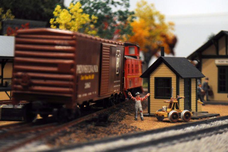 A model train travels around a track created by the Greater Baton Rouge Model Railroaders in the "Getting There" exhibition at the LSU Museum of Art at The Shaw Center for the Arts in downtown Baton Rouge.