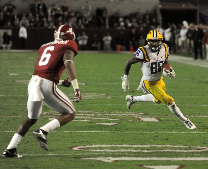 LSU junior wide receiver Jarvis Landry (80) attempts to evade Alabama junior defensive back Ha Ha Clinton-Dix (6) on Saturday, Nov. 9, 2013 during the Tiger's 38-17 loss to the Alabama Crimson Tide at Bryant-Denny Stadium in Tuscaloosa, AL.