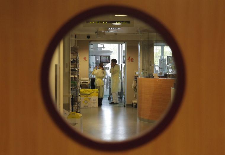 Doctors visit a patient at the intensive care unit of the Queen Fabiola Children's Hospital in Brussels, Monday, Nov. 25, 2013. Two committees of the Belgian Senate say the country&#8217;s euthanasia law should also apply to children in certain cases. A joint meeting of the chamber&#8217;s committees of social affairs and justice on Wednesday approved the proposal. (AP Photo/Yves Logghe)