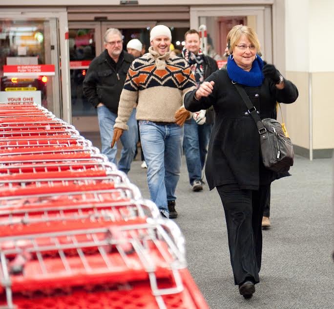 DISTRIBUTED FOR TARGET - Black Friday shoppers rush in as doors open at 8 pm after waiting hours in line at Target, Thursday, Nov. 28, 2013 in Minnetonka, Minn. (Craig Lassig / AP Images for Target)