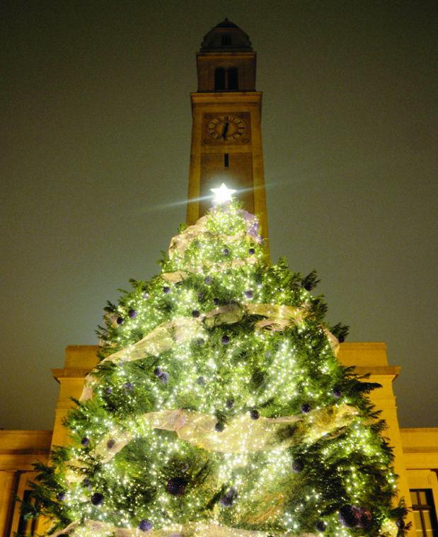 Christmas tree illuminates the night sky on Tuesday, Nov. 27, 2012 in front of Memorial Tower. The Christmas tree was light as part of the Candlelight Celebration on Tuesday.