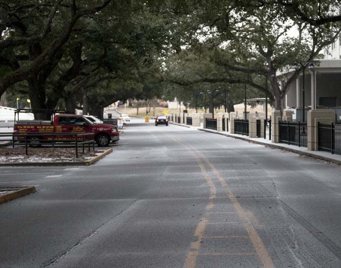 Ice begins to cover North Stadium Road on Tuesday, Jan. 28, 2014.